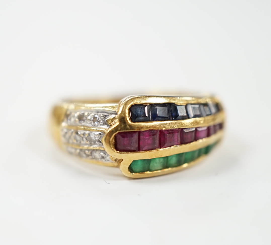 A modern 750, ruby, emerald, sapphire and diamond chip set three row ring, size I, gross weight 4.8 grams.